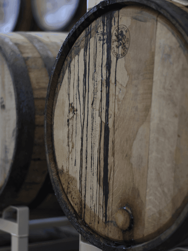 Bulk bourbon being aged in a cask