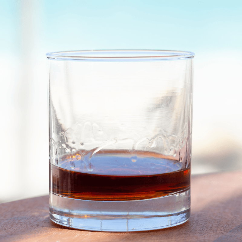 Glass of rum aged in a tropical climate